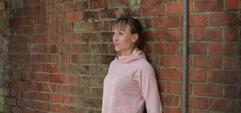 leaning against the brick wall